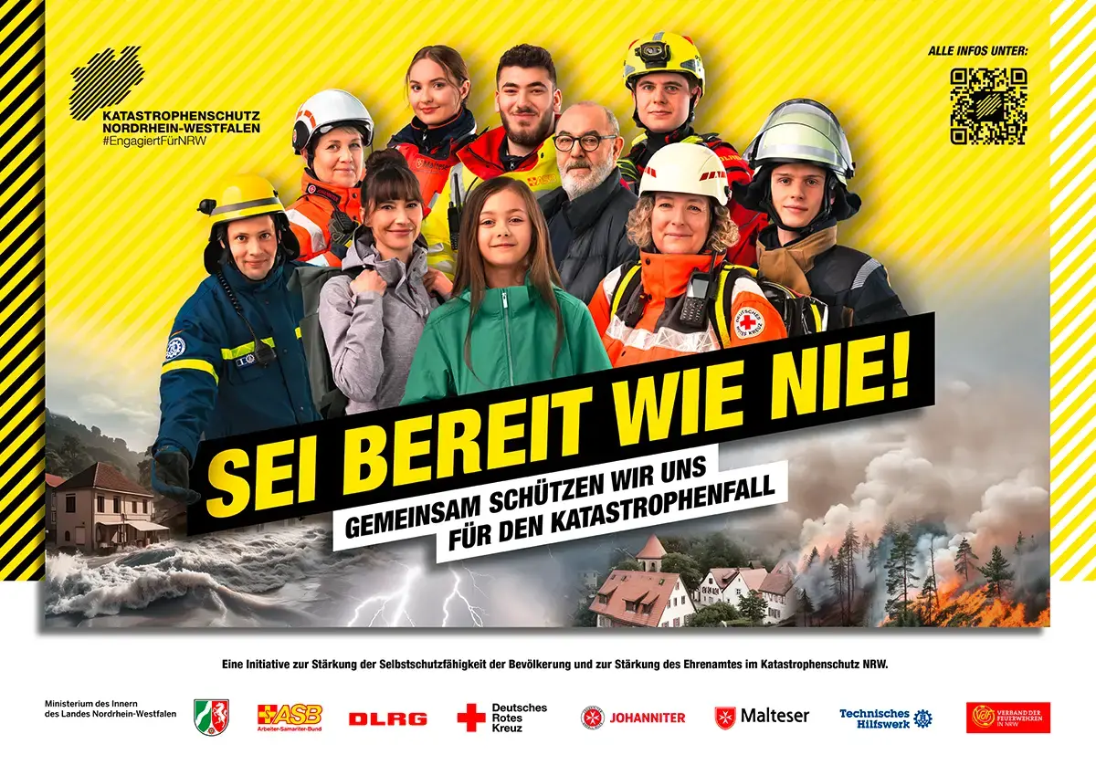 Eine Gruppe aus Katastrophenschützerinnen und Zivillisten stehen vor einem gelben Hintergrund. Auf dem Bild steht der Slogan &quot;SEI BEREIT WIE NIE!&quot;