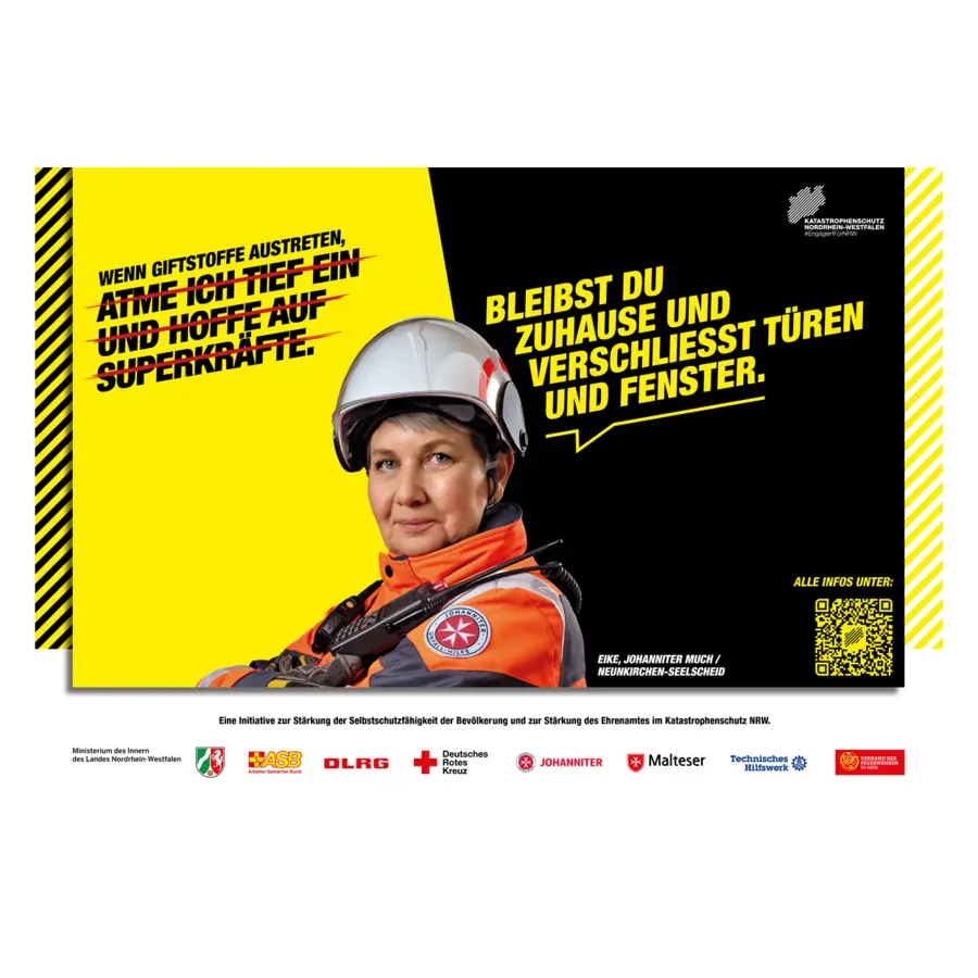 Eine Großfläche mit einer Katastrophenschützerin von der JUH.